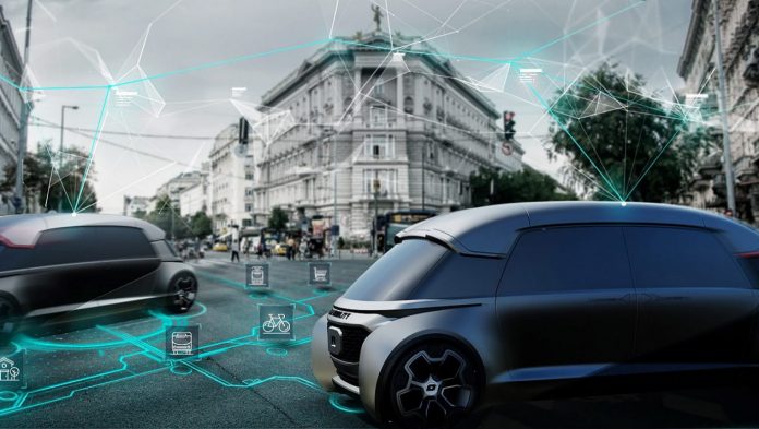 Fotografia/reprodução de ambiente urbano moderno inteligente com veículos autônomos, por meio de representação gráfica de inteligência artificial, nas cores verde e branco. Os carros se conectam aos demais sistemas de mobilidade urbana. Ao fundo, movimentação de pessoas, edifícios e um pouco de paisagismo